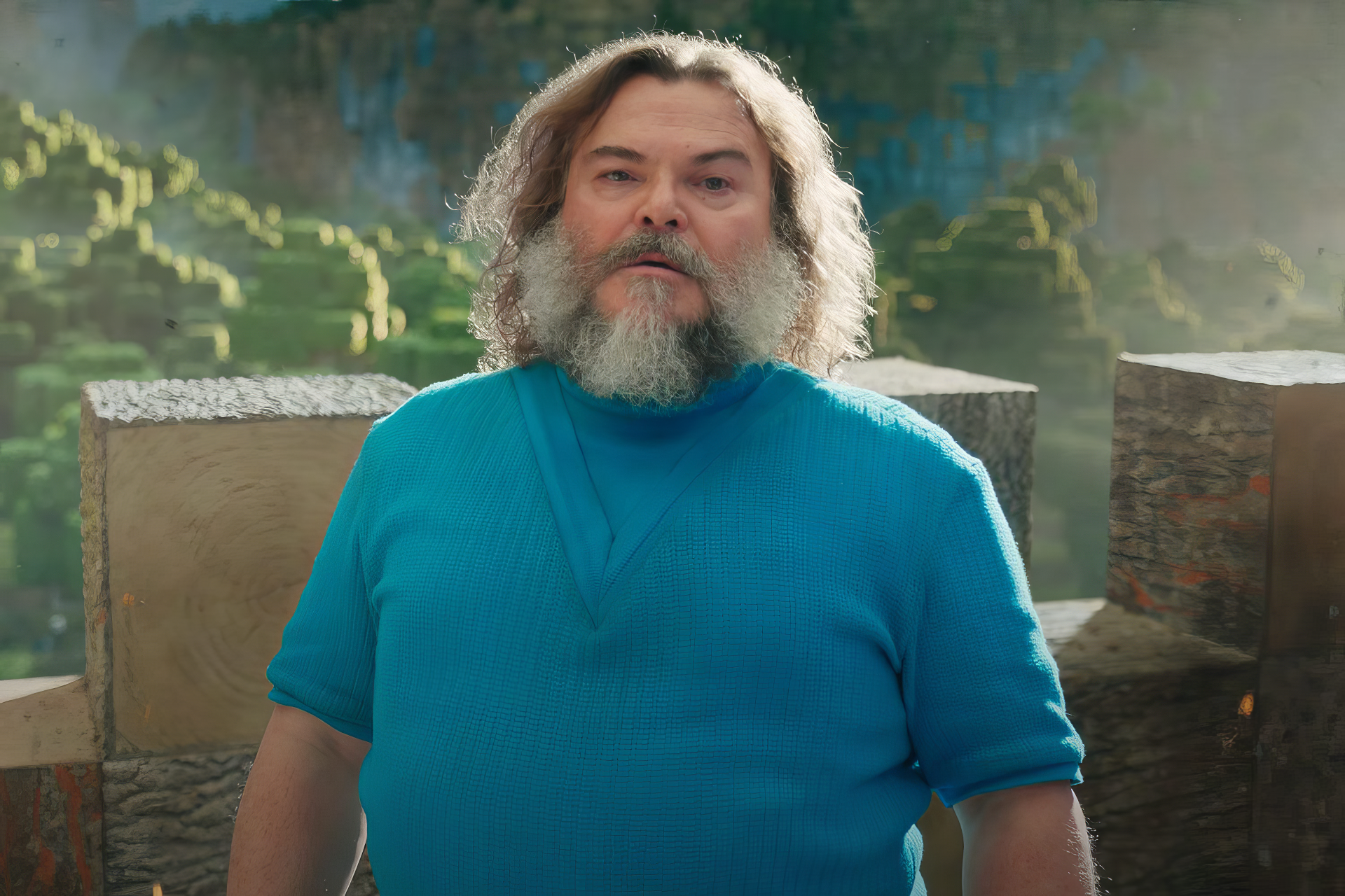 Jack Black stands in a vibrant Minecraft scene, showcasing colorful landscapes. This HD wallpaper captures the adventurous spirit of the upcoming Minecraft Movie.