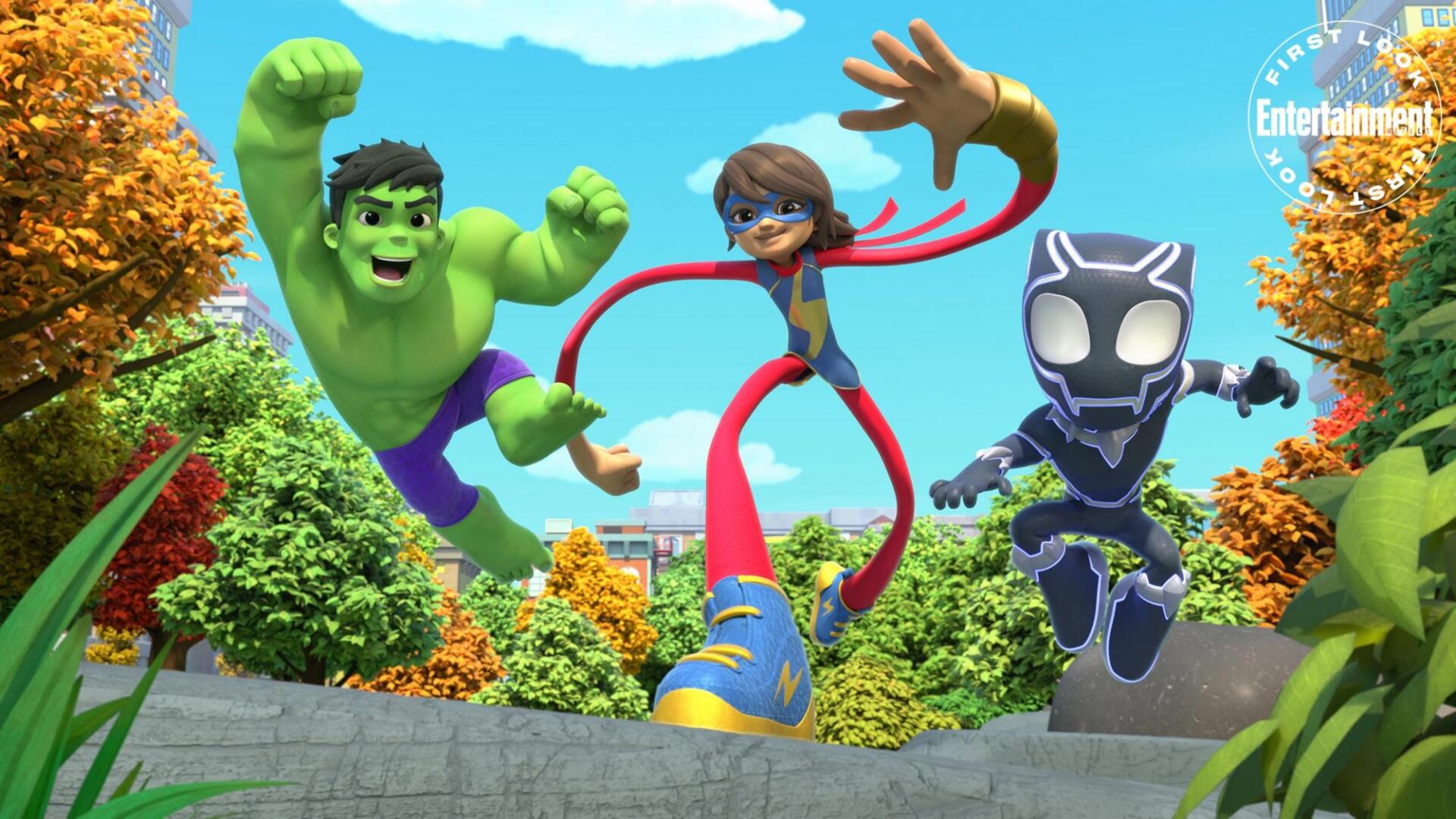 A vibrant HD wallpaper featuring characters from Spidey and His Amazing Friends, showcasing Hulk, Ms. Marvel, and Black Panther in an energetic outdoor scene.