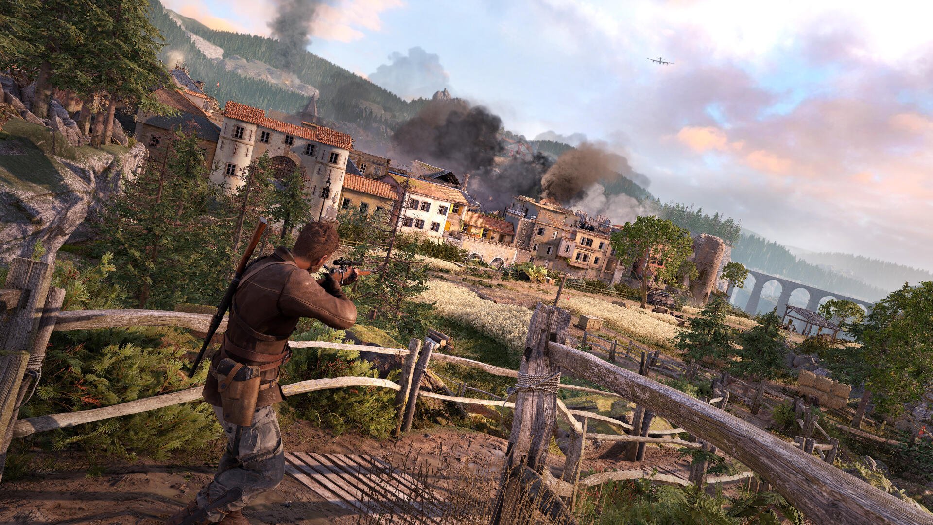 A character from Sniper Elite: Resistance takes aim in a breathtaking 4K Ultra HD landscape, featuring a war-torn village, smoke, and dramatic skies.