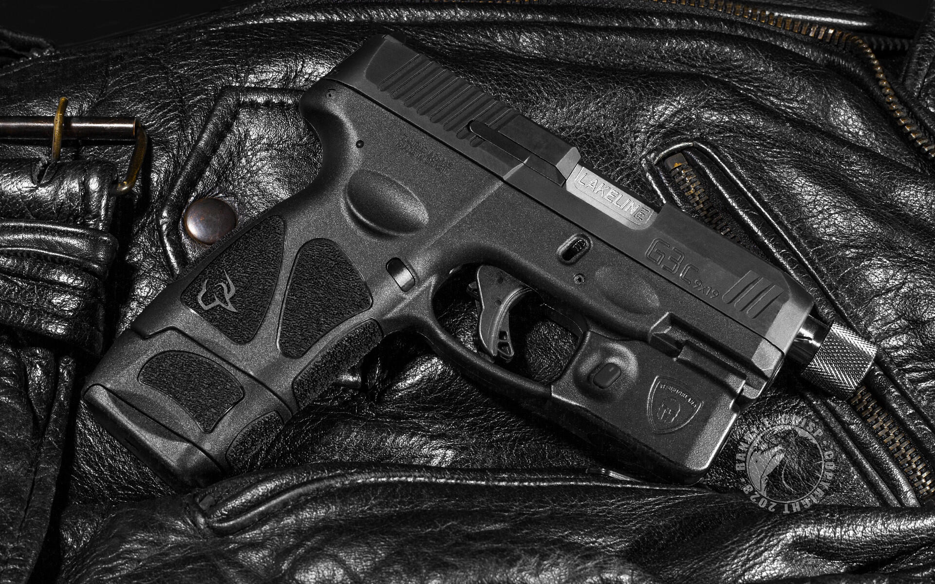 HD PC desktop wallpaper: close-up of a black semi-automatic gun resting on textured leather, high-contrast detail.