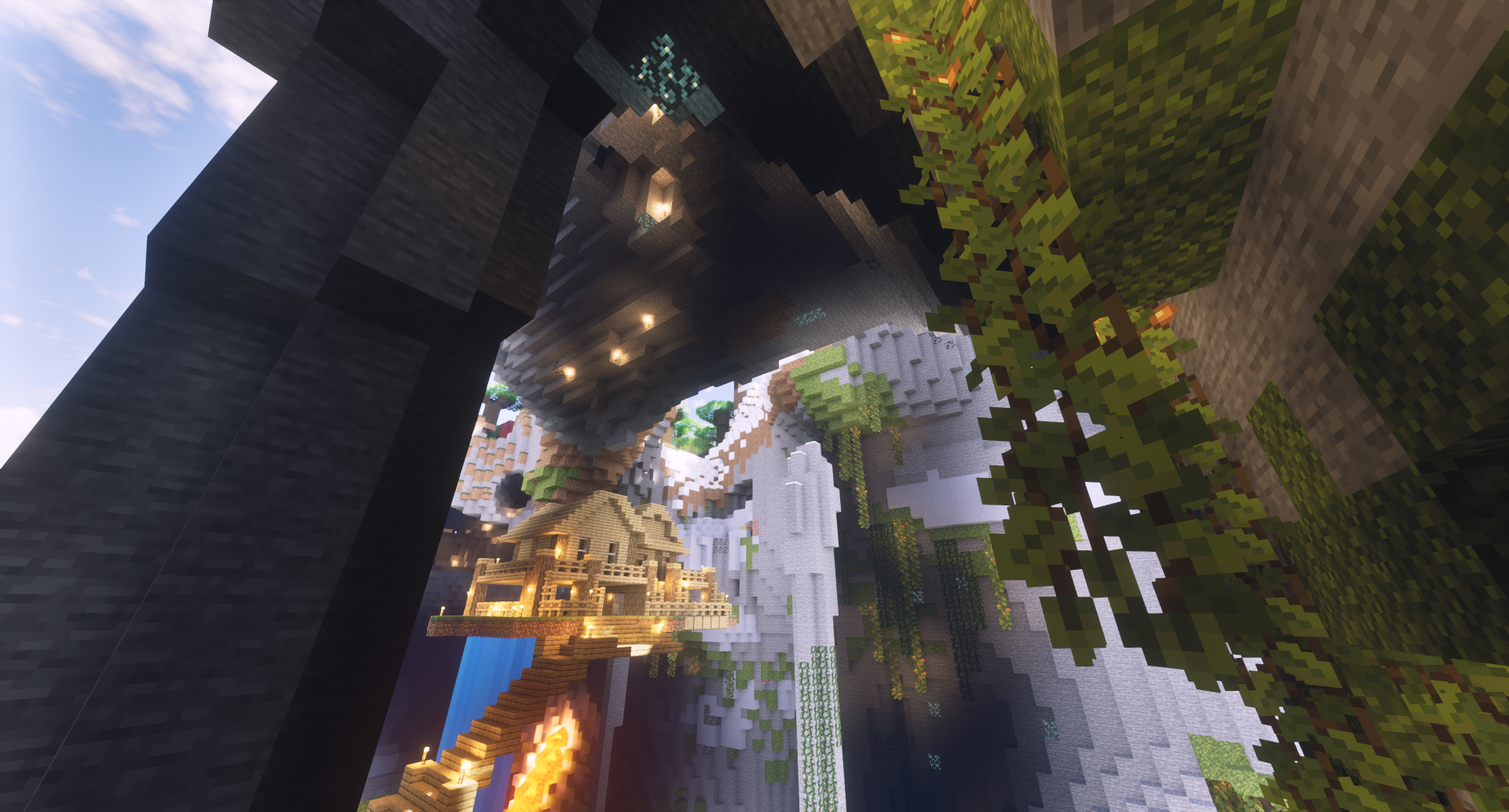 HD Minecraft PC desktop wallpaper featuring a detailed underground cavern with glowing lights, floating structures, and lush greenery.