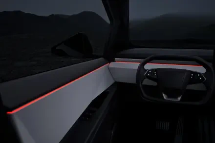 Interior view of a Tesla Cybertruck, showcasing a sleek design with illuminated accents, set against a dark backdrop. This 4K Ultra HD wallpaper highlights modern automotive aesthetics.