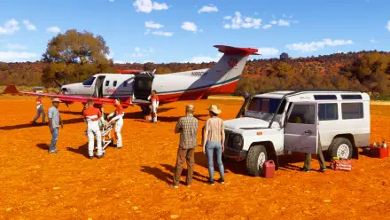 A vibrant 4K Ultra HD wallpaper from Microsoft Flight Simulator 2024, depicting a scenic desert landscape with an aircraft and people preparing for a flight.
