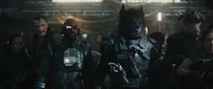 A scene from the Star Wars: Skeleton Crew TV show featuring characters in futuristic attire, set against a dimly lit, high-tech background, serving as an HD desktop wallpaper.