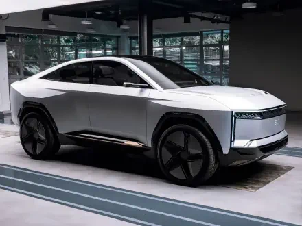 HD PC desktop wallpaper featuring the Mahindra BE 09, a sleek white electric vehicle showcasing modern design and advanced automotive technology.