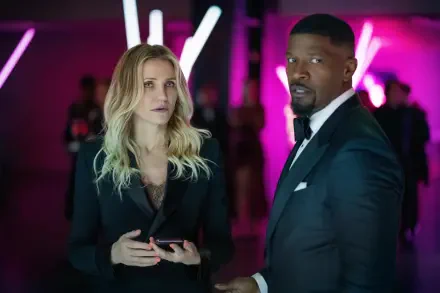 Cameron Diaz and Jamie Foxx star in Back in Action, captured in a vibrant scene with striking lighting, showcasing their intense expressions in this 4K Ultra HD wallpaper.