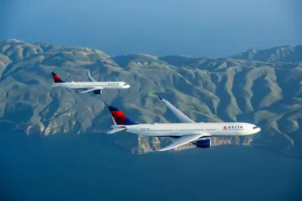 Two Delta Air Lines airplanes soar over a stunning landscape, showcasing mountains and ocean in a vibrant, 4K Ultra HD desktop wallpaper.