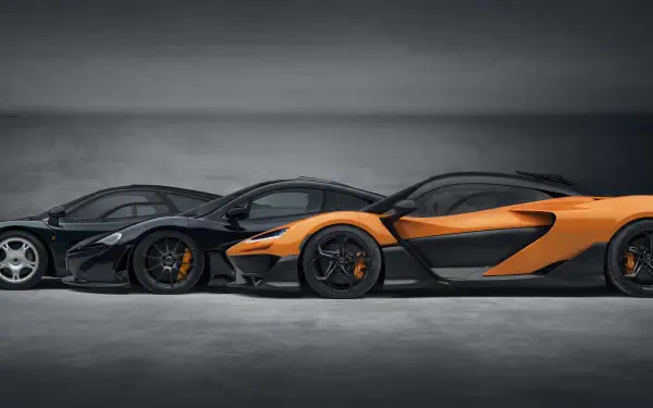 Three stunning McLaren vehicles, including the McLaren W1, are showcased in a sleek, modern setting. The image highlights their dynamic designs and performance-driven aesthetics in 8K Ultra HD.
