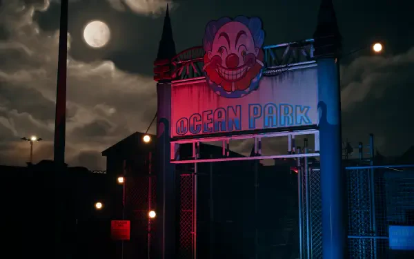 A dimly lit entrance of Ocean Park features a clown face under a full moon, embodying the eerie atmosphere of Dead Island 2 in this captivating 4K Ultra HD wallpaper.