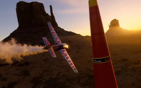 A stunning 4K Ultra HD wallpaper from Microsoft Flight Simulator 2024 featuring a sleek aircraft racing through a dramatic desert landscape at sunset.