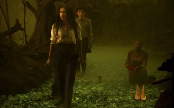A mystical scene from the TV show Agatha All Along, featuring three characters walking through a foggy, enchanted forest, embodying an eerie atmosphere in stunning 4K Ultra HD.