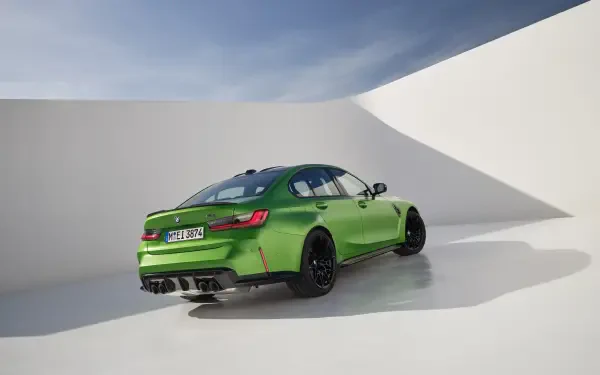 A vibrant green BMW M3 is showcased in this 4K Ultra HD desktop wallpaper, featuring a sleek design with stylish black accents against a minimalist backdrop.