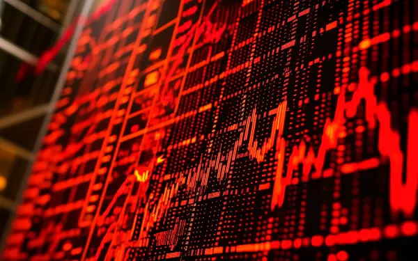 A vibrant stock market chart in red tones displays fluctuating data, capturing the dynamic essence of trading. This 4K Ultra HD image serves as an engaging desktop wallpaper and background.