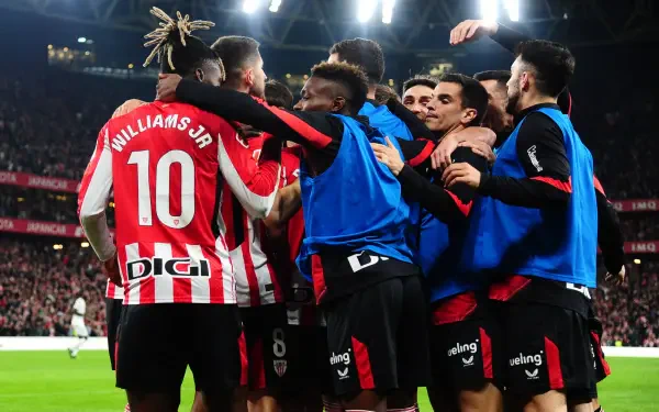 Athletic Club soccer players celebrating on the field during a match, captured in an HD PC desktop wallpaper with vibrant stadium lighting.