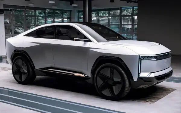 HD PC desktop wallpaper featuring the Mahindra BE 09, a sleek white electric vehicle showcasing modern design and advanced automotive technology.