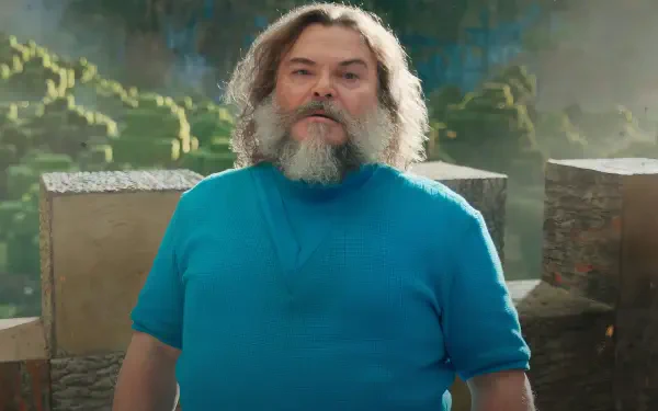 Jack Black stands in a vibrant Minecraft scene, showcasing colorful landscapes. This HD wallpaper captures the adventurous spirit of the upcoming Minecraft Movie.