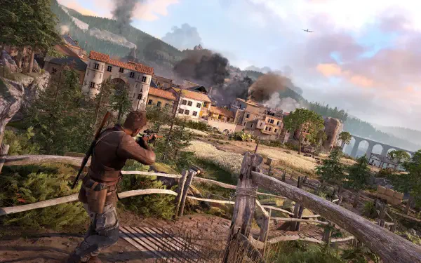 A character from Sniper Elite: Resistance takes aim in a breathtaking 4K Ultra HD landscape, featuring a war-torn village, smoke, and dramatic skies.