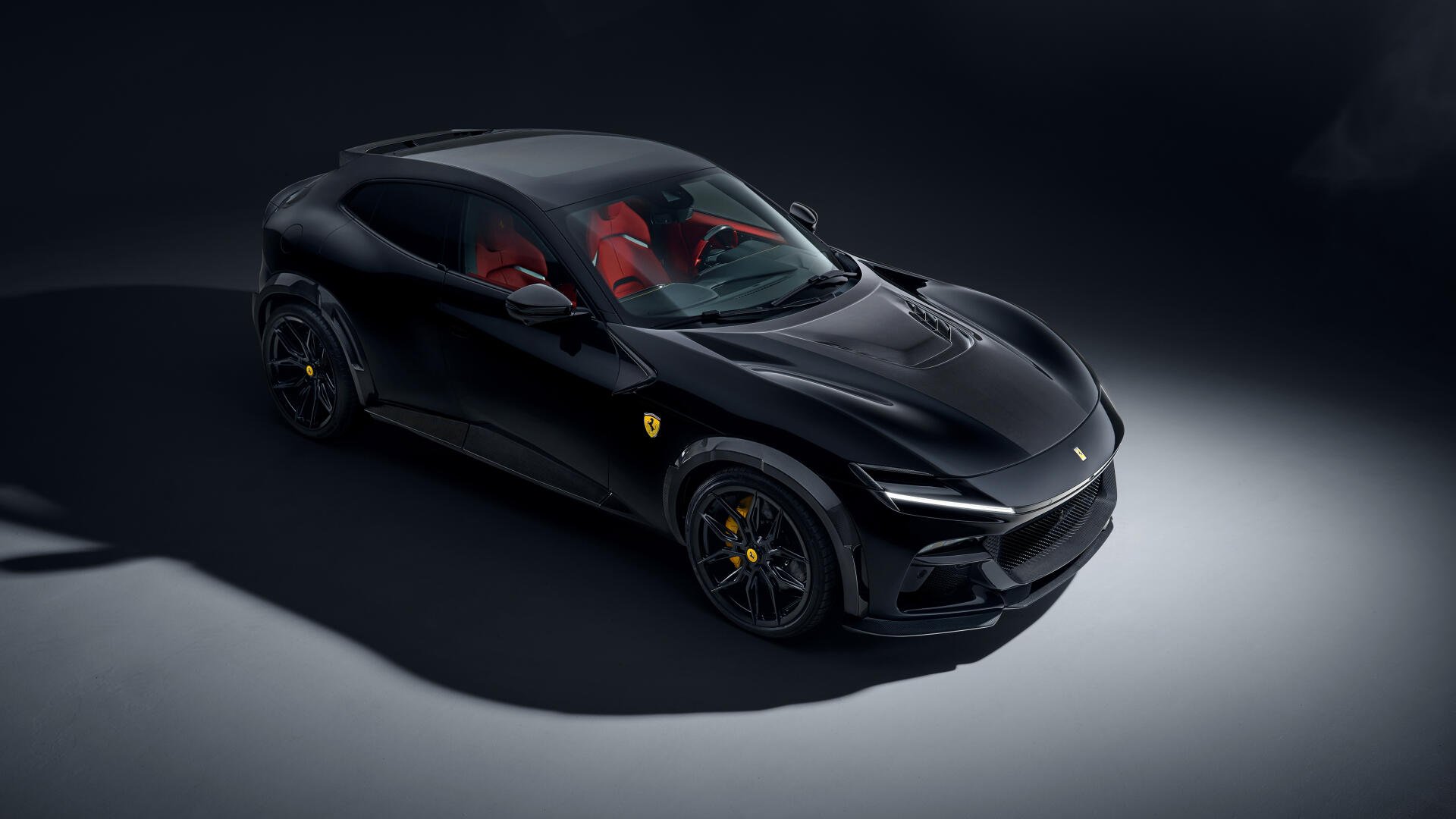 A sleek black Ferrari Purosangue, showcasing its elegant design and striking red interior, captured in stunning 4K Ultra HD. A captivating desktop wallpaper for car enthusiasts.