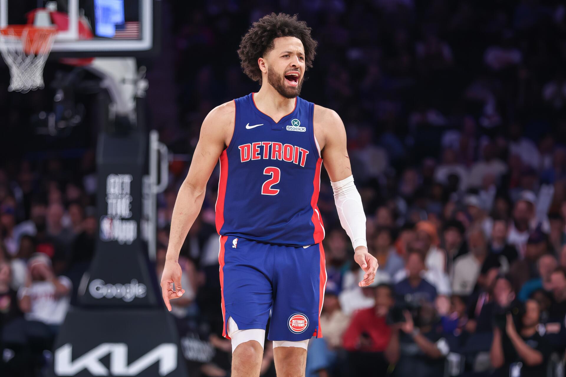 HD desktop wallpaper featuring NBA player Cade Cunningham in a Detroit Pistons uniform during a game.