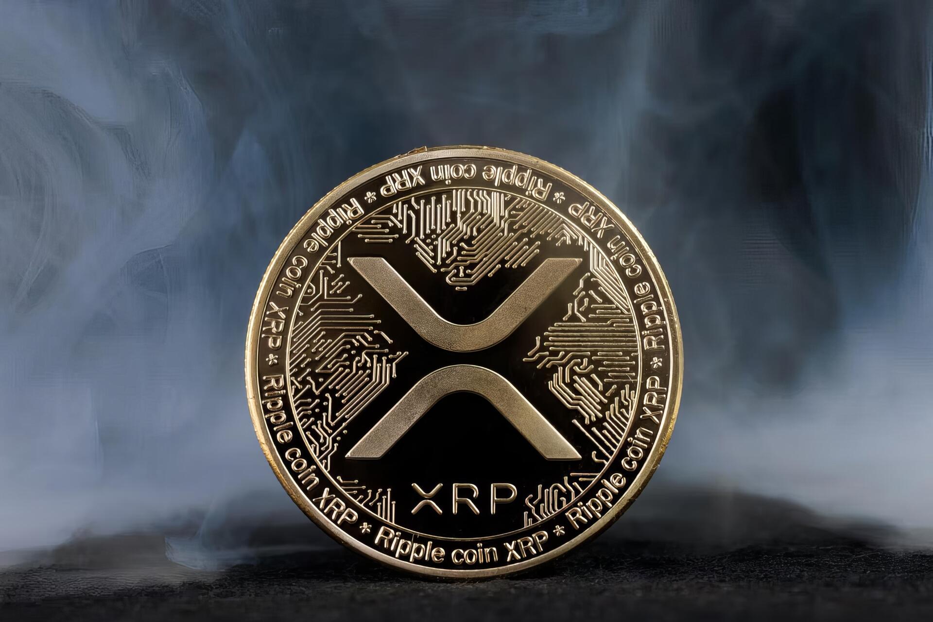 HD desktop wallpaper featuring a detailed XRP cryptocurrency coin with digital circuit patterns against a smoky, dark background highlighting technology and finance.