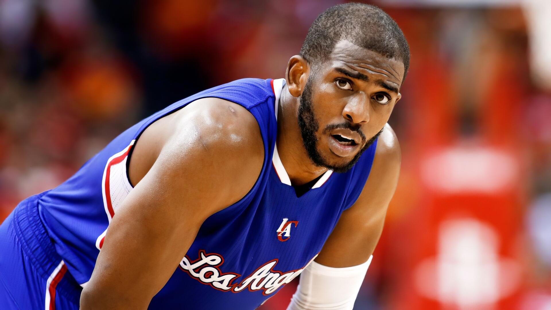 HD desktop wallpaper featuring NBA player Chris Paul in a Los Angeles Clippers uniform during a game.