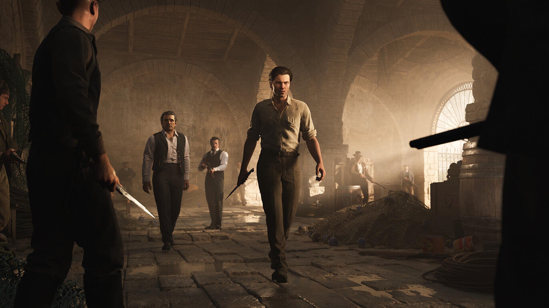 HD PC desktop wallpaper featuring intense characters from the video game Mafia The Old Country, capturing a dramatic mafia scene in a dimly lit, rustic setting.