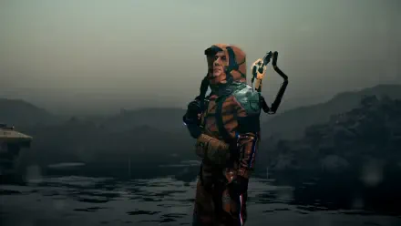 A character in an orange and blue suit stands on a misty beach, surrounded by calm waters in a scene from Death Stranding 2, captured as a 4K Ultra HD PC desktop wallpaper.