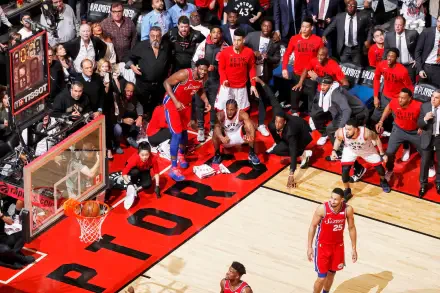 Exciting NBA action featuring the Toronto Raptors with Kawhi Leonard. Fans are engaged as a crucial play unfolds on the court, capturing the intensity of basketball at its best.