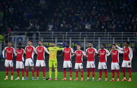 HD desktop wallpaper featuring Arsenal F.C. soccer players lined up on the field before a match, capturing the team spirit and atmosphere of a sports event.