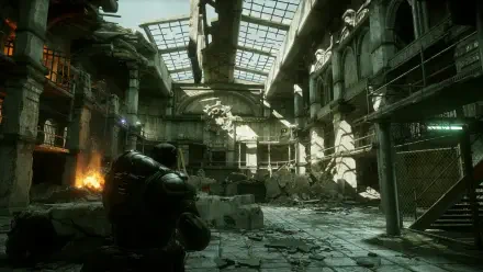 4K Ultra HD PC desktop wallpaper of Gears Of War: Reloaded featuring a heavily damaged industrial building with a soldier standing in the foreground.