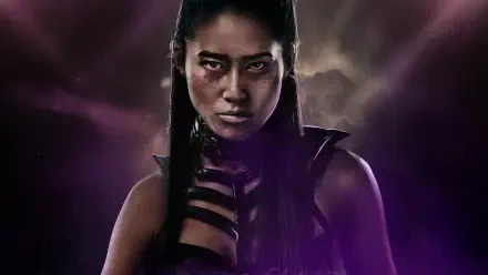 Mortal Kombat 2 (2025) PC wallpaper in 4K Ultra HD showcases a fierce female warrior against a dark, smoky background.
