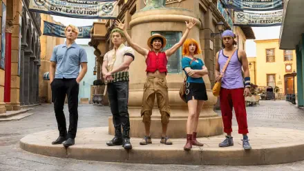 One Piece (Live Action) 4K Ultra HD wallpaper — Straw Hat crew posing in a sunlit town square, Luffy center with his straw hat raised.