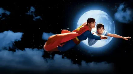Superman (1978) HD PC desktop wallpaper: Superman soars through a starry, moonlit sky with his cape billowing as he carries a woman above clouds.