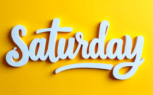 A vibrant 4K Ultra HD desktop wallpaper featuring the word Saturday in bold, white lettering against a bright yellow background.