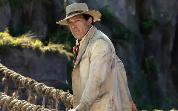 Antonio Banderas captures attention in this HD wallpaper from the movie Paddington in Peru, showcasing a scenic backdrop of lush landscapes and adventure.