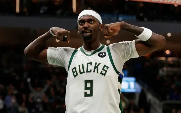 Bobby Portis Jr. of the Milwaukee Bucks celebrates on the court during an NBA game, showcasing team spirit in an engaging HD desktop wallpaper.