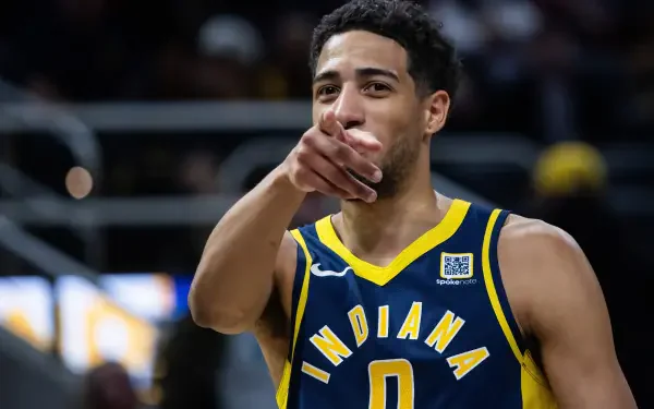 HD desktop wallpaper featuring NBA player Tyrese Haliburton in Indiana Pacers uniform, pointing towards the camera during a game.