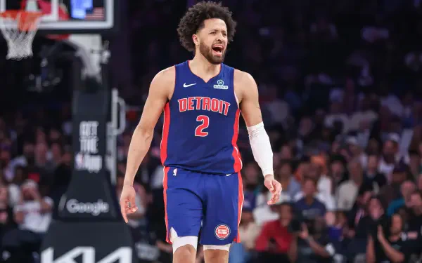 HD desktop wallpaper featuring NBA player Cade Cunningham in a Detroit Pistons uniform during a game.