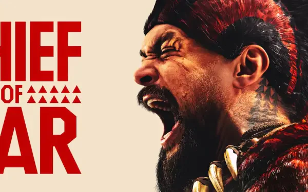 HD PC desktop wallpaper featuring a fierce close-up of the roaring warrior from the TV show Chief of War, highlighting tribal details and bold red text.