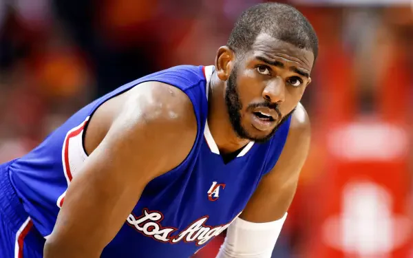 HD desktop wallpaper featuring NBA player Chris Paul in a Los Angeles Clippers uniform during a game.