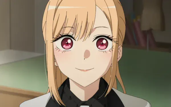 HD anime wallpaper featuring Marin Kitagawa from My Dress-Up Darling smiling gently with warm, expressive eyes in a softly lit indoor setting.
