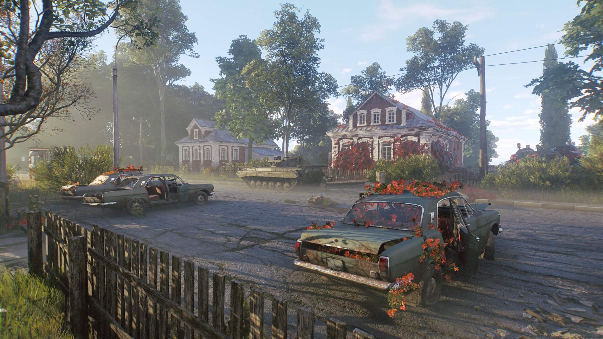 Video game Active Matter HD PC wallpaper: abandoned cars overgrown with flowers and vines on a misty suburban street, cracked pavement and wooden fences before empty, weathered houses.