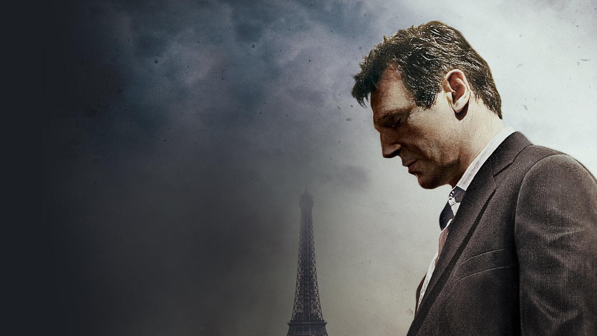 4K Ultra HD PC desktop wallpaper background: brooding man in a suit gazing down through fog with the Eiffel Tower silhouette, cinematic Taken–tagged composition.