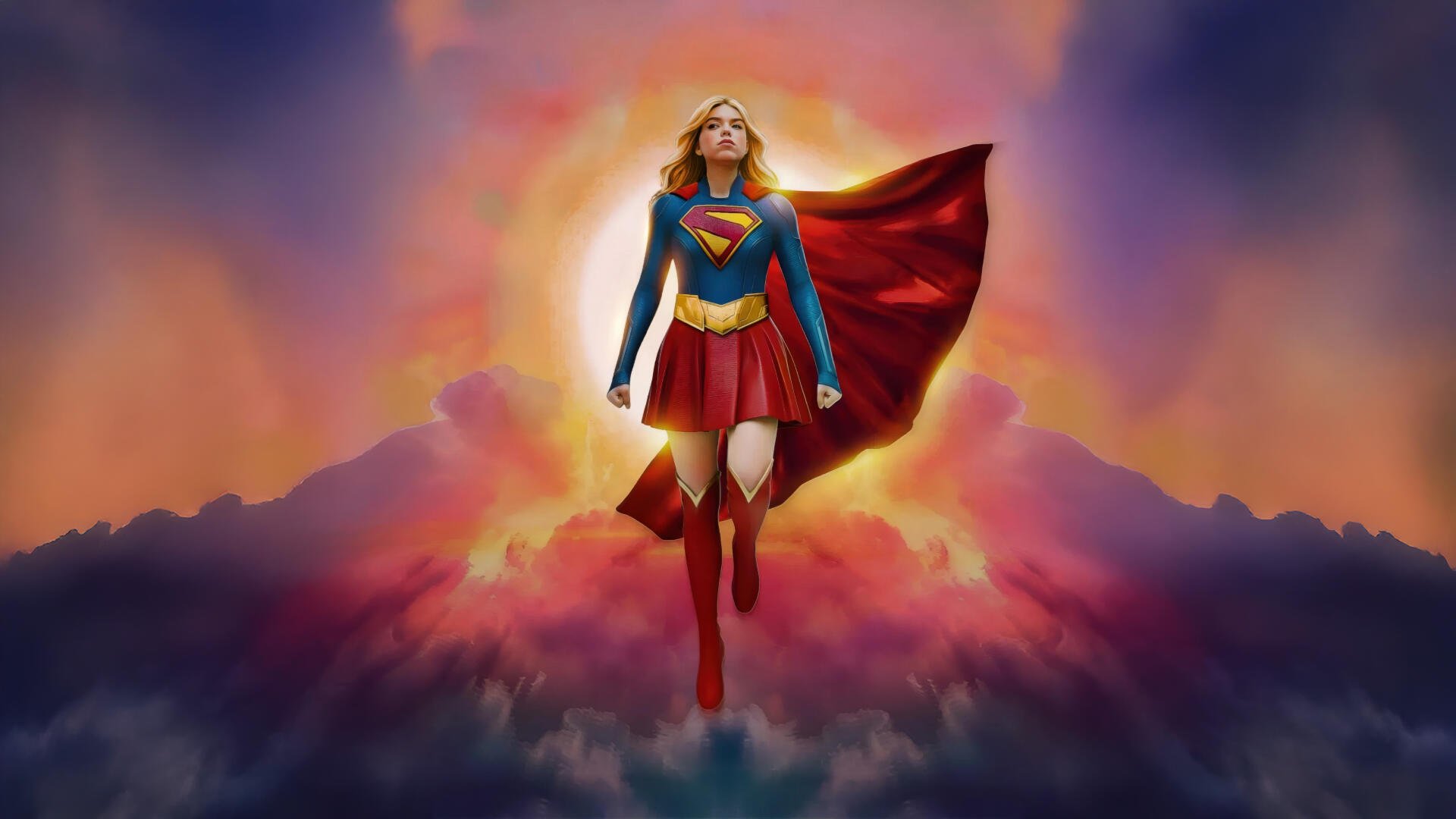 Supergirl (2026) soaring above glowing clouds at sunrise, cape billowing and emblem shining — 5K Ultra HD PC desktop wallpaper and background.