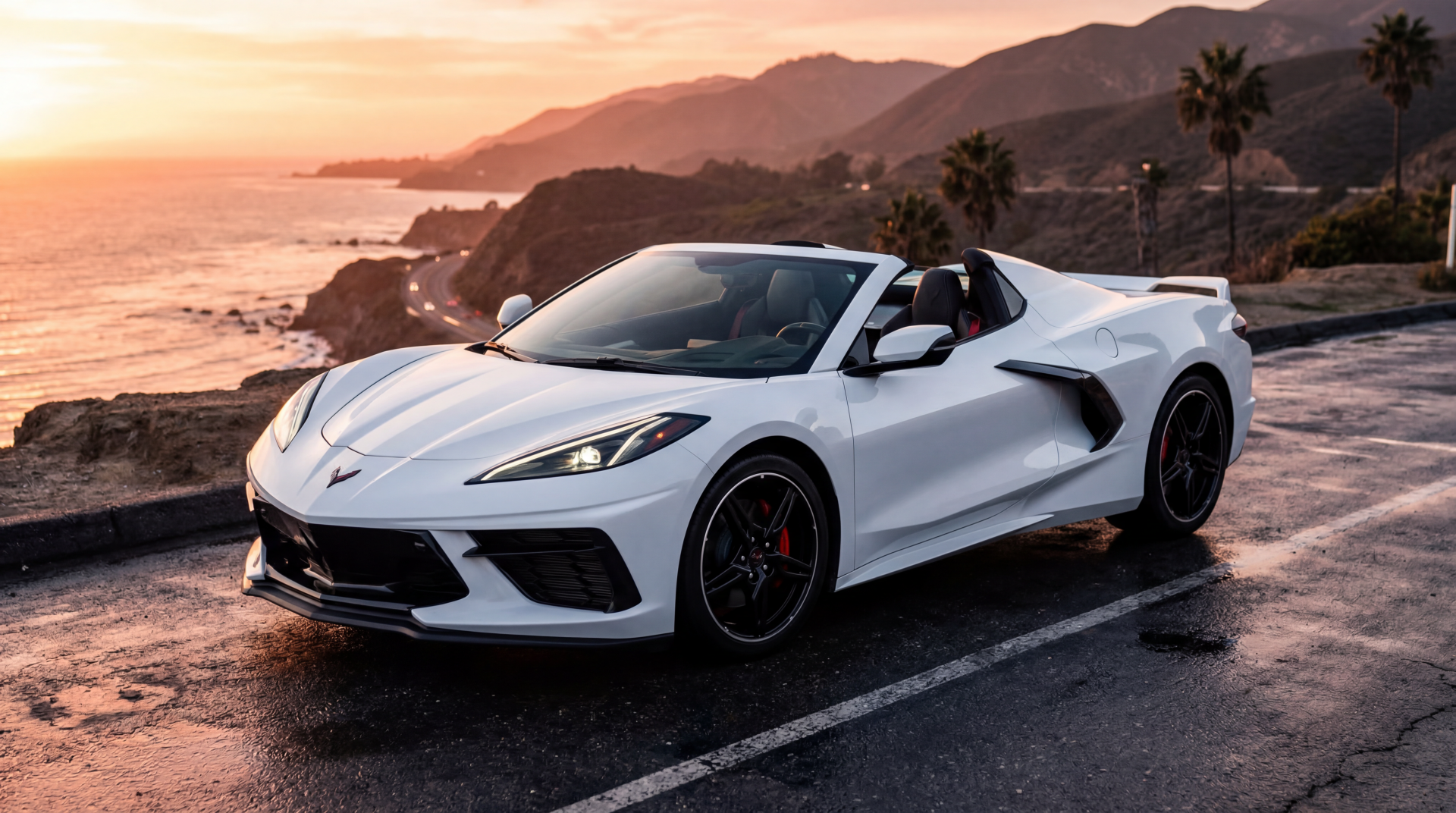 White Chevrolet Corvette convertible on a coastal road at sunset with palm trees and ocean cliffs — 5K Ultra HD PC Desktop Wallpaper and Background.