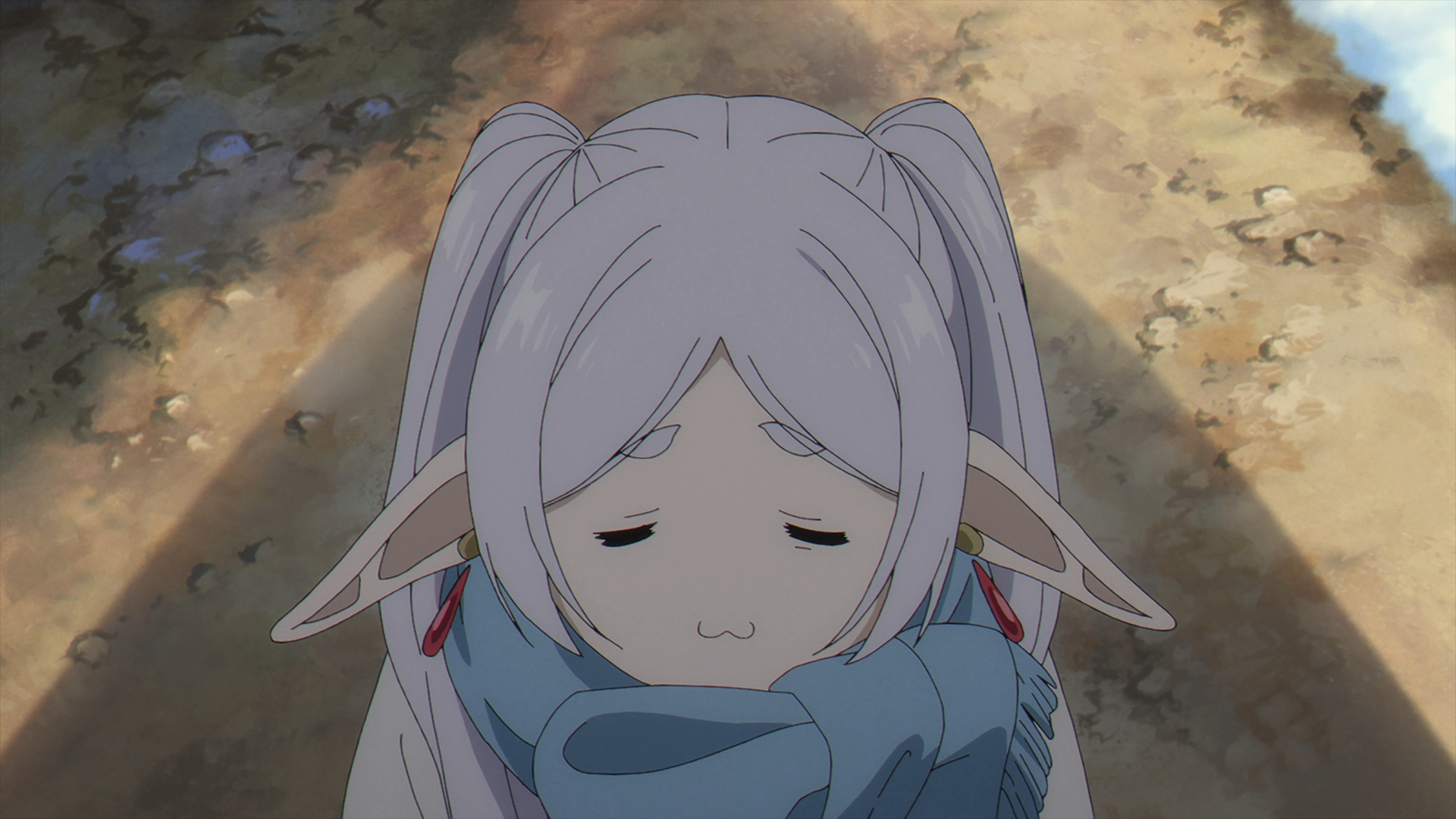 Anime HD desktop wallpaper of Frieren from Frieren: Beyond Journey's End — close-up of Frieren bundled in a blue scarf, eyes half-closed, soft expression against a sunlit path.