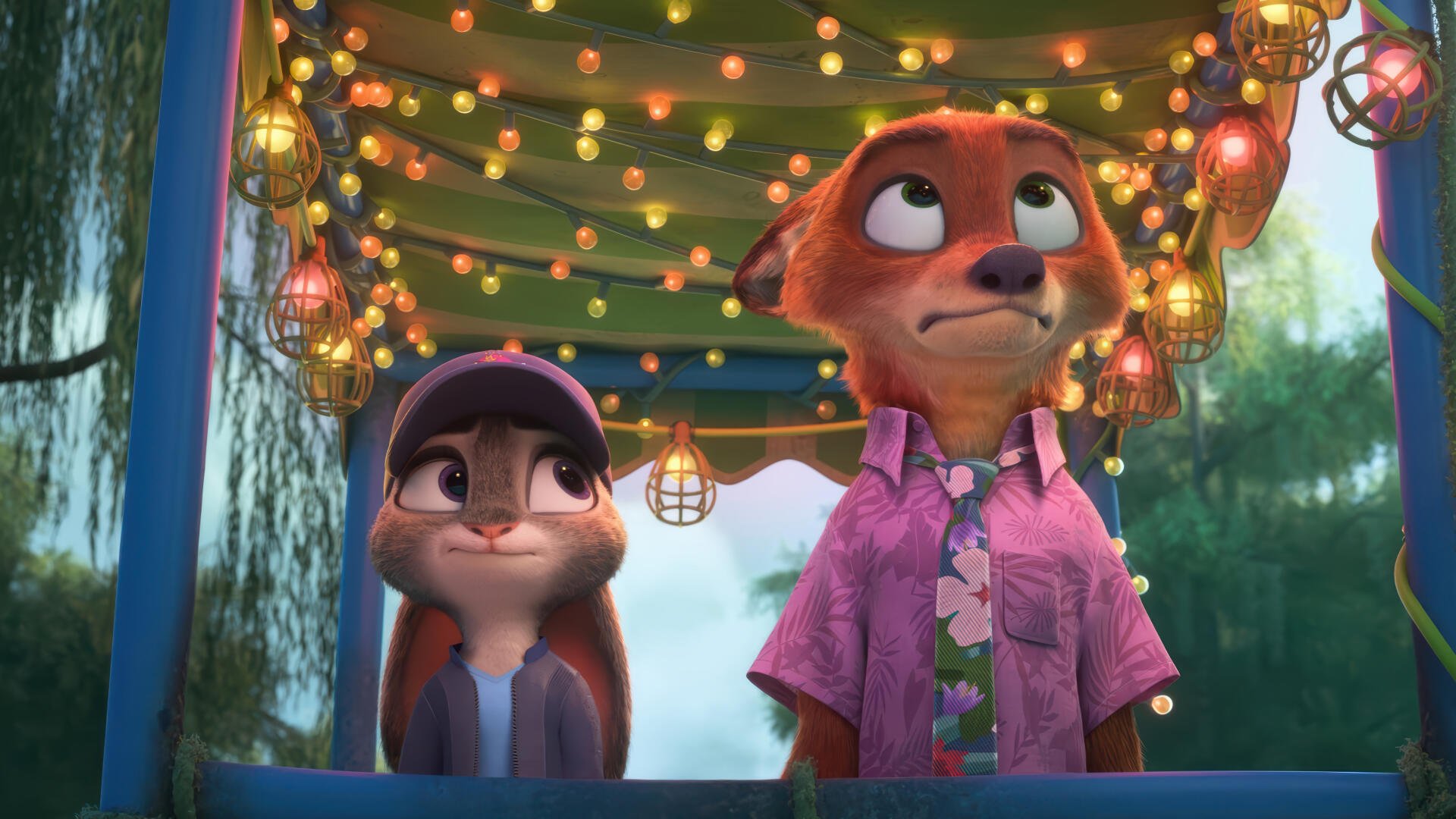 4K Ultra HD PC desktop wallpaper from the movie Zootopia showing Judy Hopps and Nick Wilde beneath string lights with a colorful festival booth backdrop.