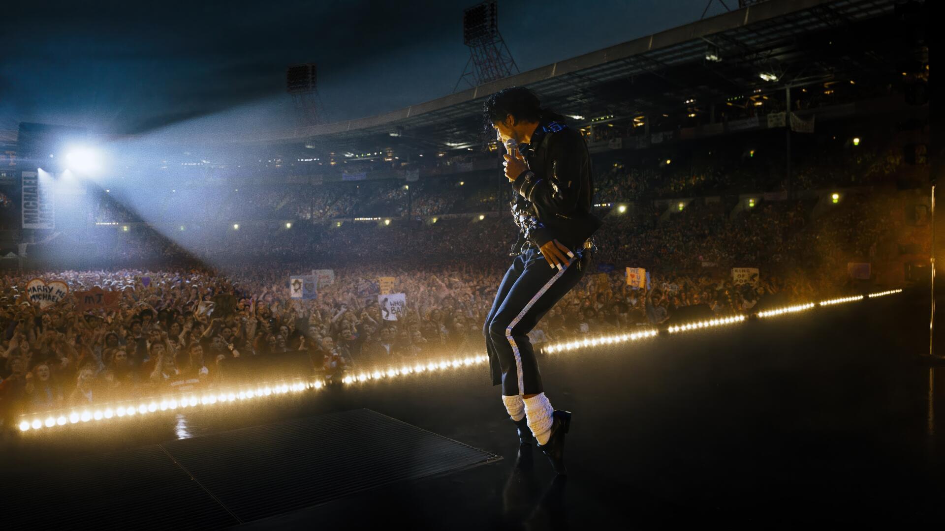 4K Ultra HD PC desktop wallpaper: concert scene from the movie Michael (2026) showing a solo performer mid-dance on a brightly lit stage before a packed stadium.