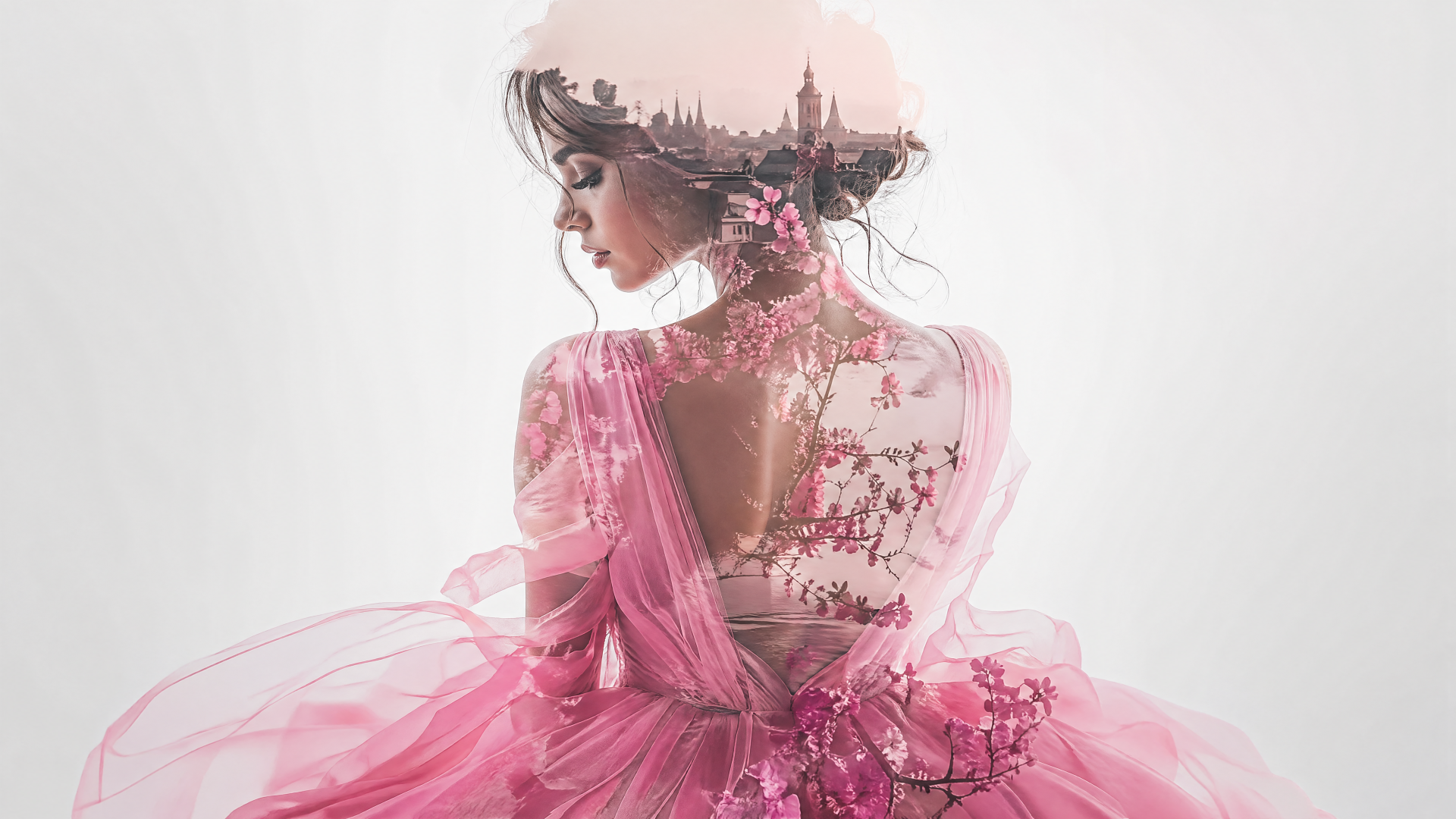 Double-exposure portrait of a woman in a flowing pink dress with cherry-blossom details and a faint city skyline, 4K Ultra HD PC desktop wallpaper.