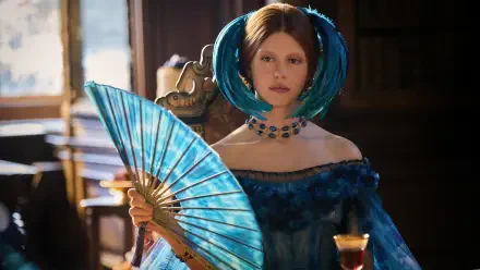 Woman in teal looped hair and a blue Victorian gown, holding a matching fan in an ornate interior — TV Show Frankenstein (2025) 4K Ultra HD PC desktop wallpaper/background.